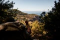 beautiful view of mountain landscape and man hiker pointing the way with trekking stick Royalty Free Stock Photo