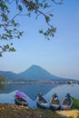 Beautiful view with mountain reflection and fisherman boats on the lakes