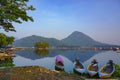 Beautiful view with mountain reflection and fisherman boats on the lakes