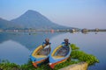 Beautiful view with mountain reflection and fisherman boats on the lakes