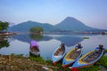 Beautiful view with mountain reflection and fisherman boats on the lakes