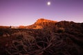 Beautiful view of the mountain ridge at sunset with full moon on the background. Teide national park on Tenerife Royalty Free Stock Photo