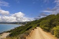 Beautiful view of mountain road along Mediterranean sea with tropical plant on both sides. Royalty Free Stock Photo