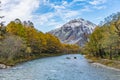 beautiful view of mountain with snow and fog with blue river and Royalty Free Stock Photo