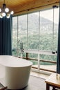 beautiful view of the mountains from the bathroom. modern interior in a house in nature Royalty Free Stock Photo