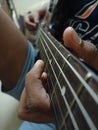 Beautiful view of musical instruments electric Guitar with young man fingers Royalty Free Stock Photo