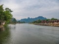 Beautiful view of nam song river with riverside restaurant and the mountain at Vangvieng city Lao Royalty Free Stock Photo