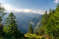 A beautiful view from a natural viewpoint in Slovenia mountains. Rays of sun shining through the mist on a very sunny