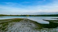 Beautiful view of nature landscape on sunny summer day. Green tall trees on lake coast line. Beautiful nature Royalty Free Stock Photo