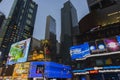 Beautiful view of night Broadway with skyscrapers in Manhattan with advertising television screens against background of night sky