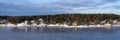 Beautiful view of the northern snow covered coast of the Baltic sea in winter day. Panorama of the shores of Scandinavia Royalty Free Stock Photo