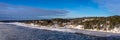 Beautiful view of the northern snow ice covered coast of the Baltic sea in winter day. Royalty Free Stock Photo