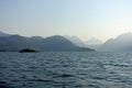 A beautiful view of an ocean with waves with layers of mountains in the background, along the sunshine coast, british columbia, ca Royalty Free Stock Photo