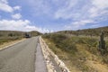 Beautiful view of off-road truck on asphalt road stone desert of natural park on island of Aruba. Royalty Free Stock Photo