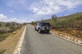 Beautiful view of off-road truck on asphalt road stone desert of natural park on island of Aruba. Royalty Free Stock Photo