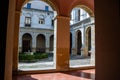 Beautiful view of an old building through archs in Xativa, Spain