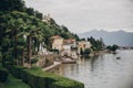 Beautiful view on old buildings and boats on lake in Stresa city, Italy. Architecture and shore on Lago Maggiore in sunny day on Royalty Free Stock Photo