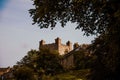Beautiful view of an old English Castle through the green trees Royalty Free Stock Photo