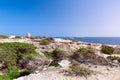 Beautiful view of the old observation tower Torre De Ses Portes and the rocky coast of the Ibiza island Royalty Free Stock Photo