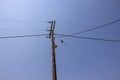 Beautiful view of old power line on blue sky background. Royalty Free Stock Photo