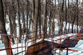 Beautiful view with an old rusty stairway in a snow-covered park