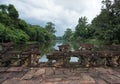 Beautiful view of a old Stone Bridge, the Tropical river and the rain forest, which reflecting in the water Royalty Free Stock Photo