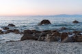 Beautiful view of orange sunset with rocks in Calabria, Mediterranean Sea, Italy. Tropical colorful sunrise landscape