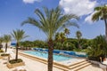 Beautiful view of the outdoor swimming pool at the hotel with the Caribbean Sea in the background. Royalty Free Stock Photo