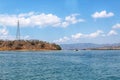 Beautiful View Over the Calm Sea Water Accompanied by Floating Boats Large Mountains with Clear Cloudy Blue Sky Background Royalty Free Stock Photo