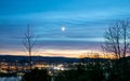 view over Inverness city from above the Kessock Bridge on a moonlit winter's night in Scotland