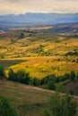 Beautiful view over the picturesque hills with a house in the di