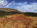 Beautiful view overlooking rusty red desert, distant mountains in Fuerteventura island, Canaries, Spain