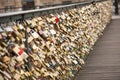 Beautiful view of padlocks on the bridge of lovers symbolizing the love in Paris, France
