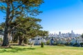 Beautiful view of Painted Ladies, colorful Victorian houses located near scenic Alamo Square in a row, on a summer day with blue