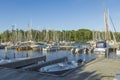 Beautiful view of parking place for motor boats on beautiful lake in  forest. Royalty Free Stock Photo