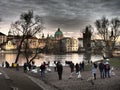 Beautiful view of people having fun at the Vltava River and Charles Bridge in the background
