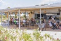 Beautiful view of people at hotel outdoor restaurant. Greece