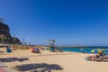 Beautiful view of people on sandy beach with lifeguard tower on sunny summer day. Gran Canaria. Royalty Free Stock Photo