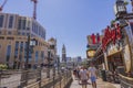 Beautiful view of people strolling along the Las Vegas Strip near the Treasure Island casino hotel on a clear and sunny day. Royalty Free Stock Photo