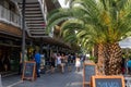 Beautiful view of people walking on a street on a Somorrostro beach in Barcelona, Spain