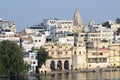 UDAIPUR,RAJASTHAN,INDIA - NOVEMBER 11: indian people enjoying the beautiful view of Pichola lake and palaces at embankment Royalty Free Stock Photo