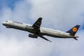 Beautiful view of a plane Lufthansa Airbus A321-200, sorrowing through the bright blue sky