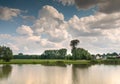 beautiful view of the pond against the backdrop of white clouds Royalty Free Stock Photo