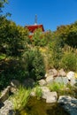 Beautiful view of pond with fragment of Tahoto Pagoda in Japanese garden. Public landscape park of Krasnodar or Galitsky Park Royalty Free Stock Photo