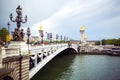 Beautiful view of Pont Alexandre III, bridge with golden sculptures and street lamps, Paris, France Royalty Free Stock Photo