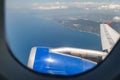 A beautiful view through the porthole of the plane on the Mediterranean coast, in the Antalya region, Turkey Royalty Free Stock Photo