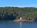 Beautiful view of Portlock Point Lighthouse on Prevost Island, part of the Gulf Islands in British Columbia, Canada. Royalty Free Stock Photo