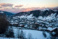 Beautiful view of Postavaru Mountains at sunset in a cold and sunny day during winter season Royalty Free Stock Photo