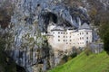 The beautiful view of Predjama Castle in Postojna Cave