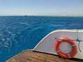 Beautiful view of the Red Sea from the deck of the yacht. Bright orange lifebuoy is on board the yacht. Hurghada, Egypt Royalty Free Stock Photo